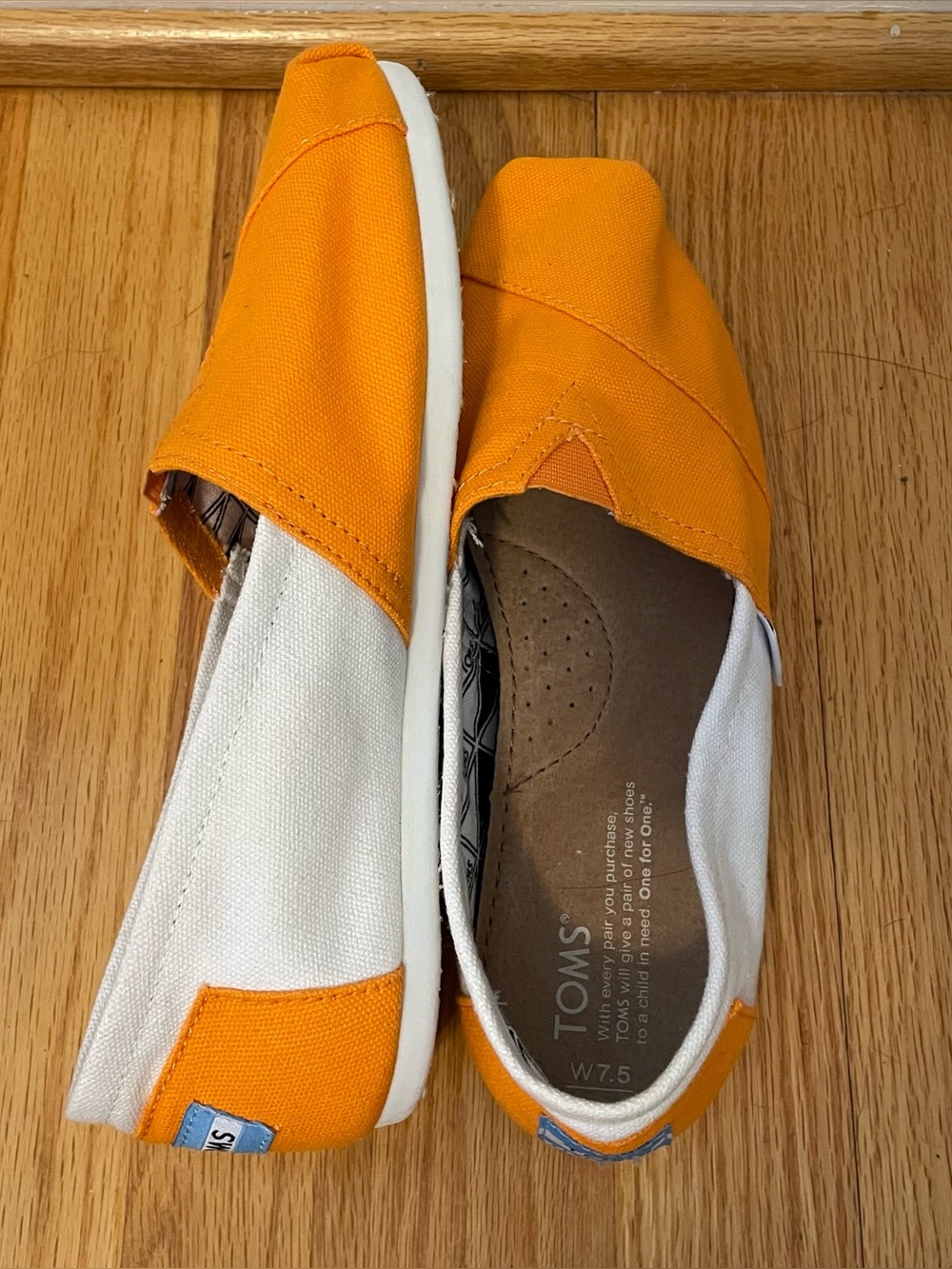 Tom’s women’s 7.5 Orange and White Shoes